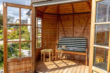 The summerhouse is a perfect spot for reading a book.