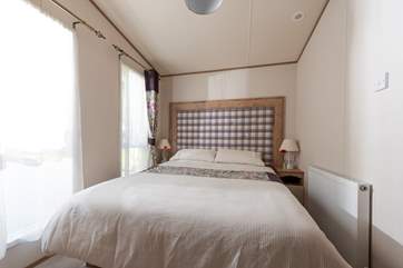 The master bedroom has a double bed (there is also storage under the bed).