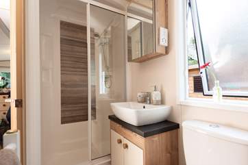 The lovely shower-room complete with shower, WC, wash-basin and heated towel rail.