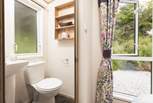 The lovely shower-room is complete with shower, WC, wash-basin and heated towel rail. 