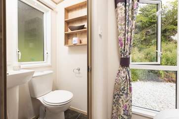 The lovely shower-room is complete with shower, WC, wash-basin and heated towel rail.