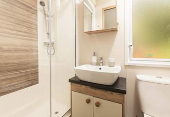 The lovely shower-room is complete with shower, WC, wash-basin and heated towel rail. 