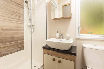The lovely shower-room is complete with shower, WC, wash-basin and heated towel rail.