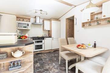 The spacious open plan kitchen has everything you need to prepare tasty meals for the family.