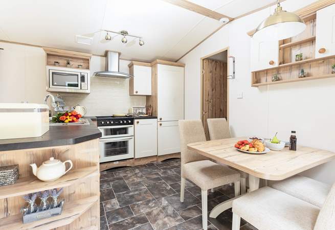 The spacious open plan kitchen has everything you need to prepare tasty meals for the family. 