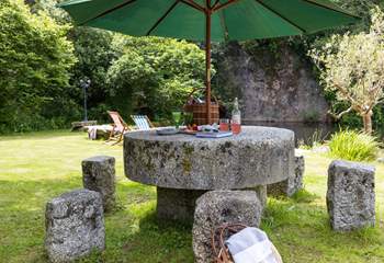 Summer picnics around your magnificent table, carved from an old mill stone. 