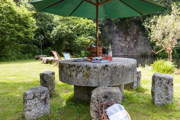 Summer picnics around your magnificent table, carved from an old mill stone.