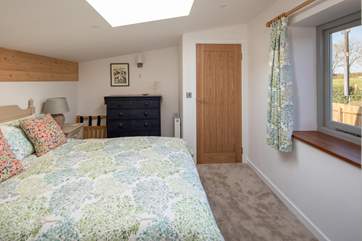 The bedroom is so cosy and welcoming.