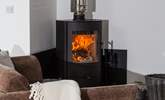 The wood-burner is perfect for cosy film nights snuggled up on the comfy sofa.  - Thumbnail Image