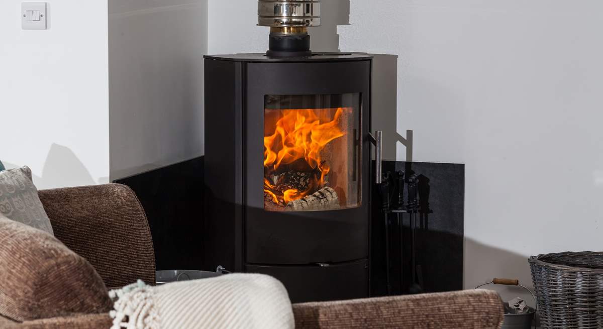 The wood-burner is perfect for cosy film nights snuggled up on the comfy sofa. 