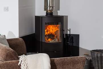 The wood-burner is perfect for cosy film nights snuggled up on the comfy sofa.