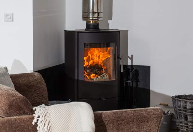 The wood-burner is perfect for cosy film nights snuggled up on the comfy sofa. 