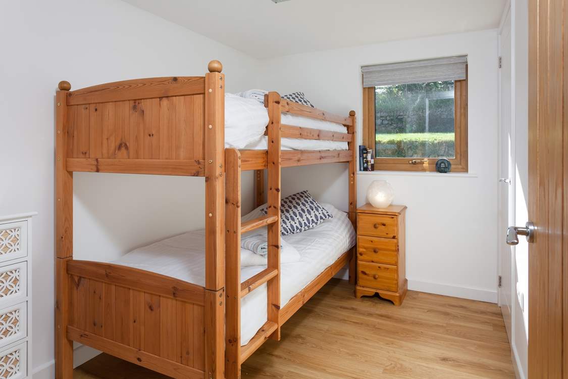 Bedroom 2 has three-foot bunk-beds.
