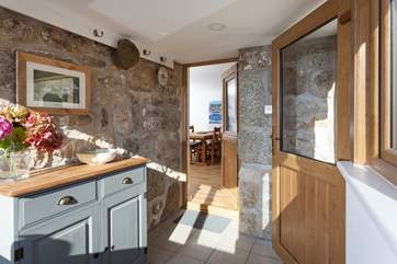 The sunny porch is the perfect spot to leave your walking boots, hats and scarves.