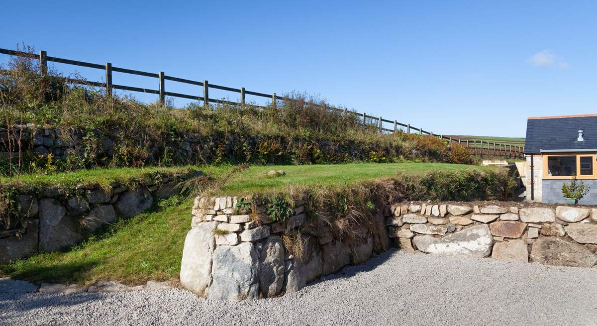 The grassed bank above Woon Summer is not enclosed. Please do not allow children or dogs onto this area. 