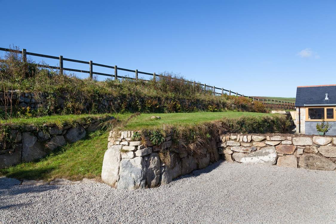 The grassed bank above Woon Summer is not enclosed. Please do not allow children or dogs onto this area.