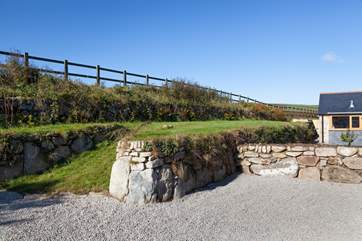 The grassed bank above Woon Summer is not enclosed. Please do not allow children or dogs onto this area.