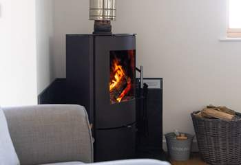 Snuggle up by the cosy wood burner.