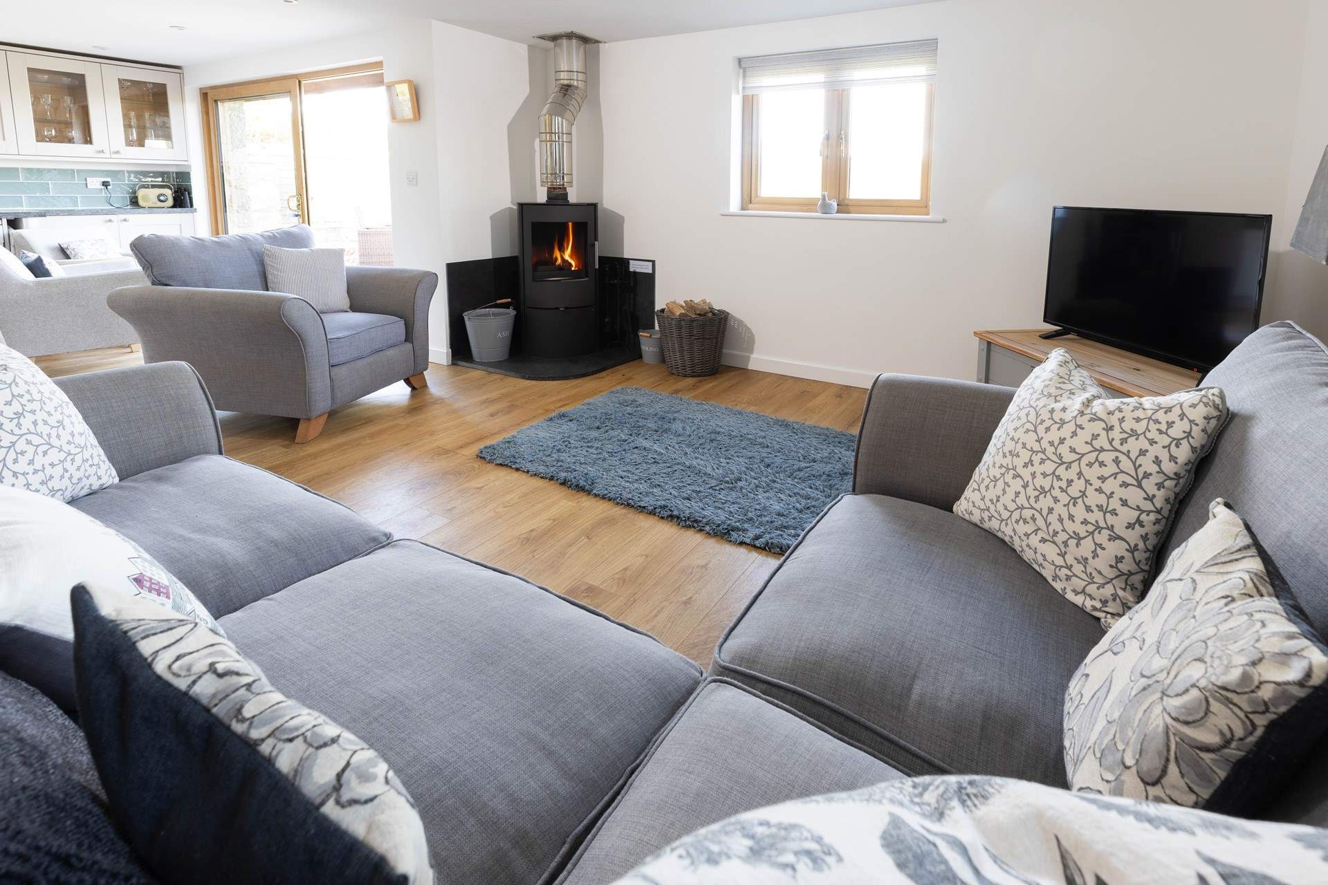 Snuggle up in front of the cosy wood-burner. 