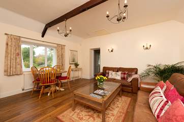This bright, spacious sitting-room feels very homely.