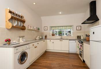 A lovely country-style kitchen is equipped to the highest standard.