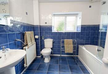 The bathroom is spacious and bright.