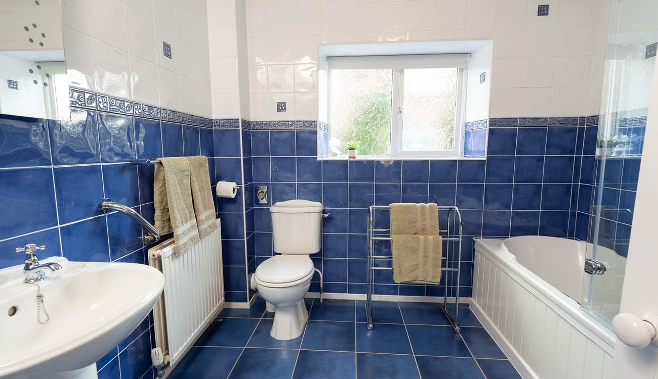 The bathroom is spacious and bright.