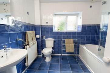 The bathroom is spacious and bright.