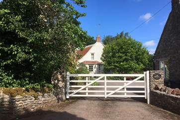 Magnolia Cottage is the stone building on the right and the owners' home is across the driveway - close enough to be on hand should you need them but you are assured of the utmost privacy. You have private use of all this area behind the white gate.