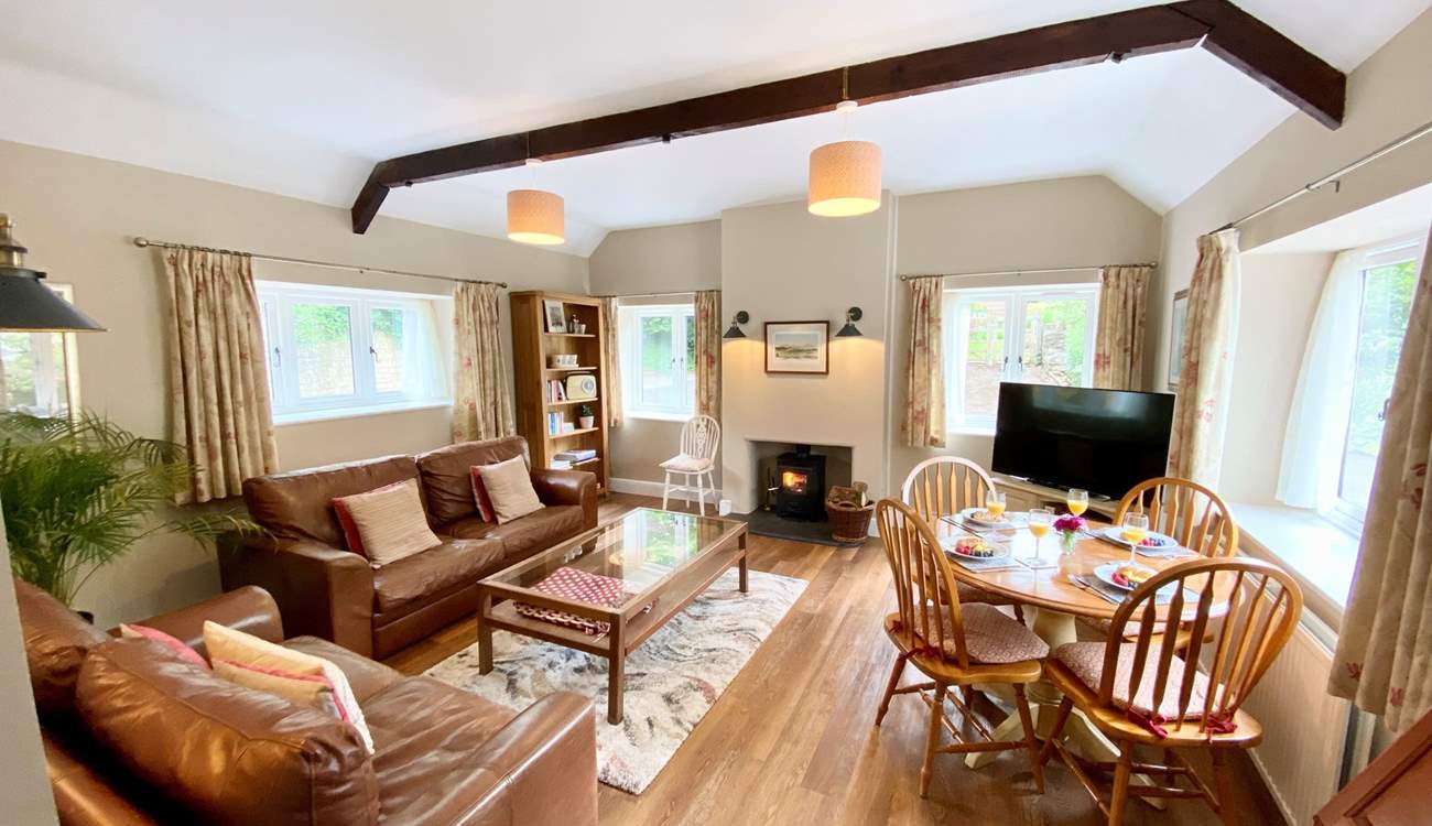 This bright, spacious sitting-room feels very homely.