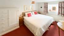 This lovely bright and large bedroom can be configured as a large double bed or two singles.