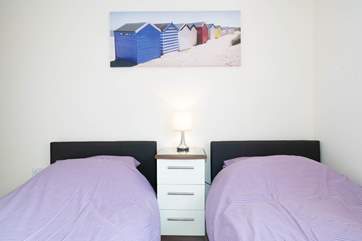 The fourth bedroom on the first floor with twin beds..