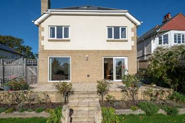 Please note there are three steps from the patio area and a slight drop onto the grass from the back door. Please supervise young children at all times.