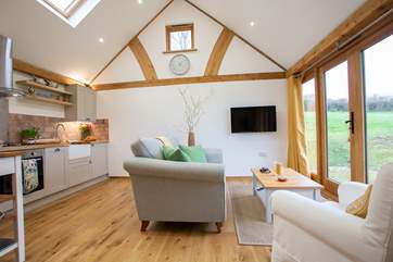 The living area has everything close to hand and that wonderful countryside view.