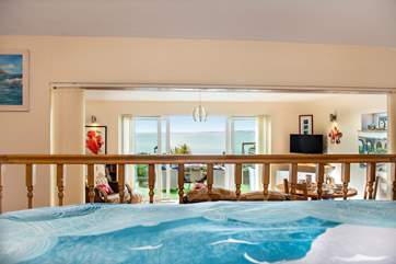 Lying in bed you can still enjoy that view - for some extra privacy there is a screen that can be pulled across.