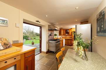 Throw open the French doors in the kitchen that lead out to the expanse of space outside.