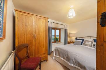 Every bedroom has uninterrupted countryside views, this double bedroom faces over the front of the cottage.