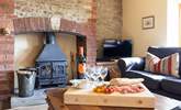 Enjoy a glass of your favourite whilst sat on a choice of comfy sofas in front of the log burner.  - Thumbnail Image