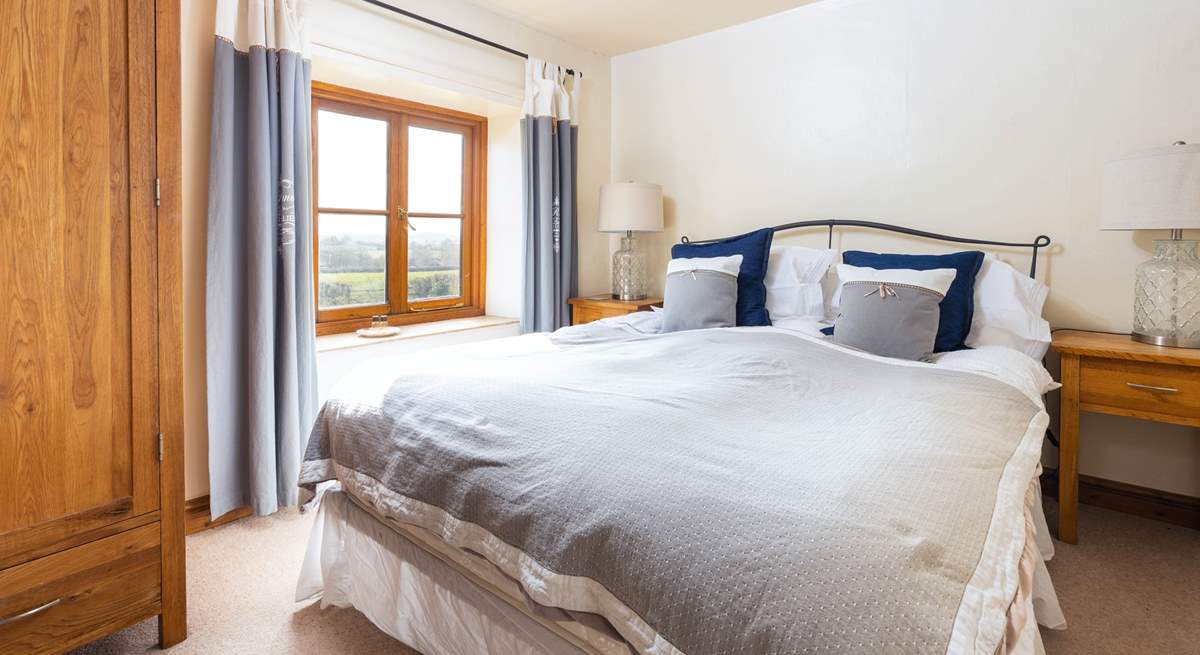 Every bedroom has uninterrupted countryside views, this double bedroom faces over the front of the cottage.