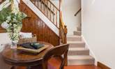 We love the character of the original floors and dual staircase leading up to the bedrooms. - Thumbnail Image