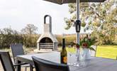 Enjoy al fresco dining in the delightful garden. - Thumbnail Image