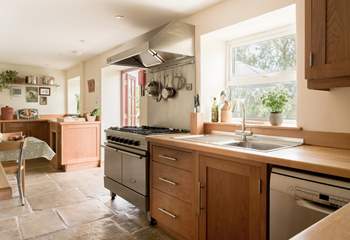 Large well equipped kitchen and breakfast area with doors to the patio