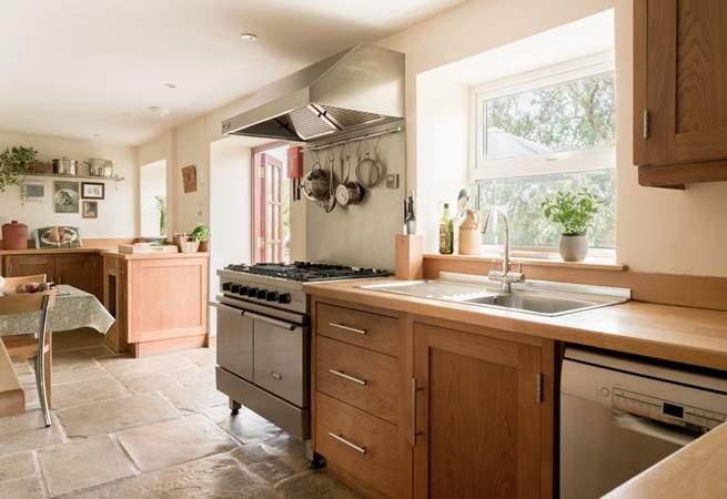 Large well equipped kitchen and breakfast area with doors to the patio