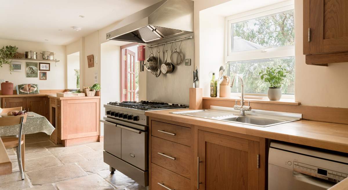 Large well equipped kitchen and breakfast area with doors to the patio