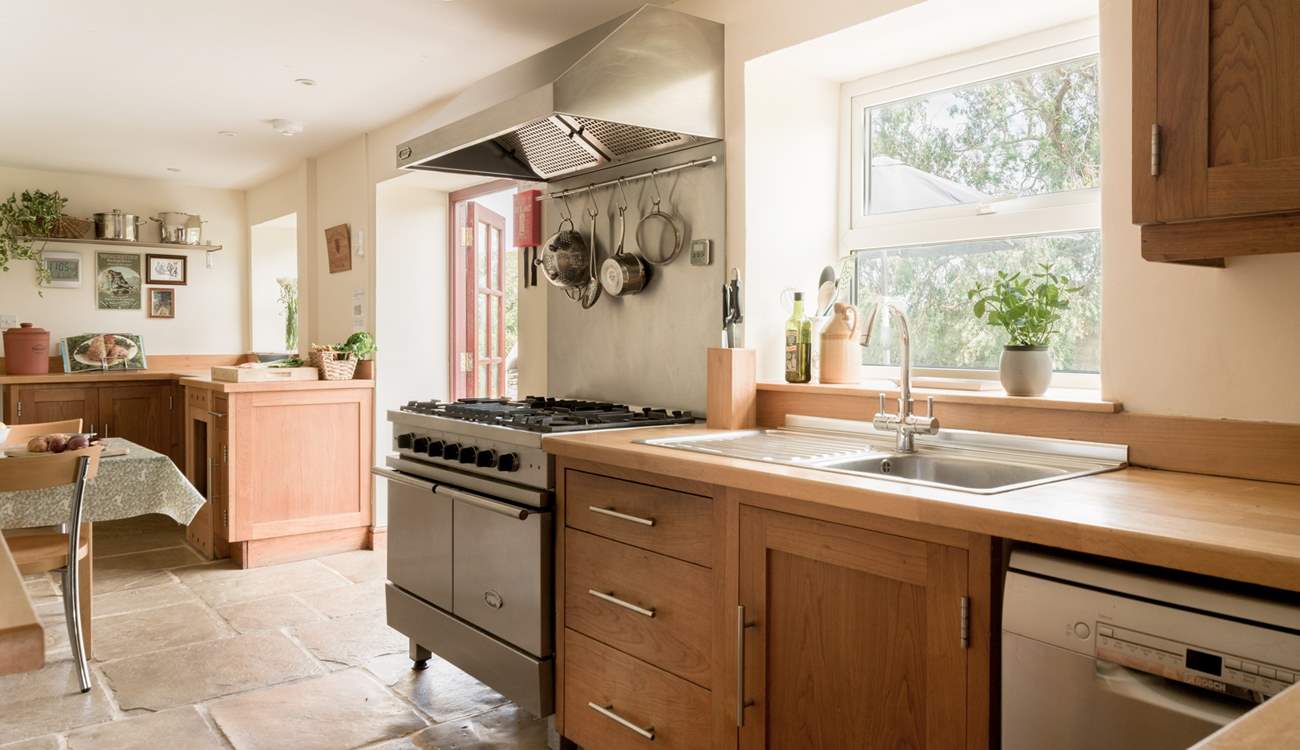Large well equipped kitchen and breakfast area with doors to the patio