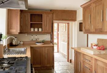 Entry into the kitchen via the handy boot-room off the parking area