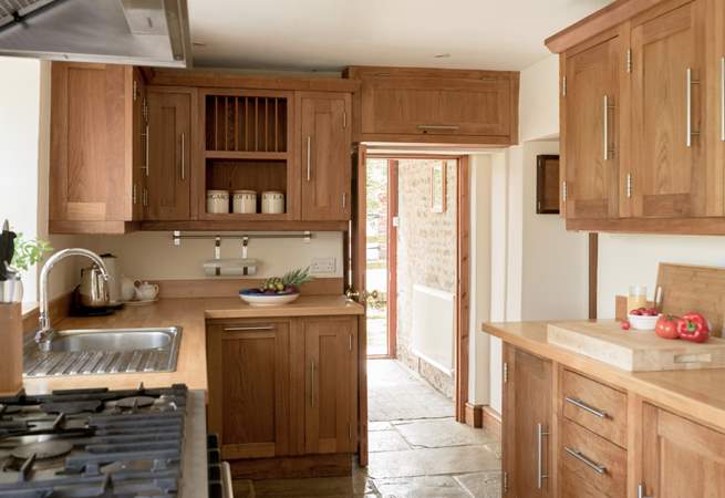 Entry into the kitchen via the handy boot-room off the parking area