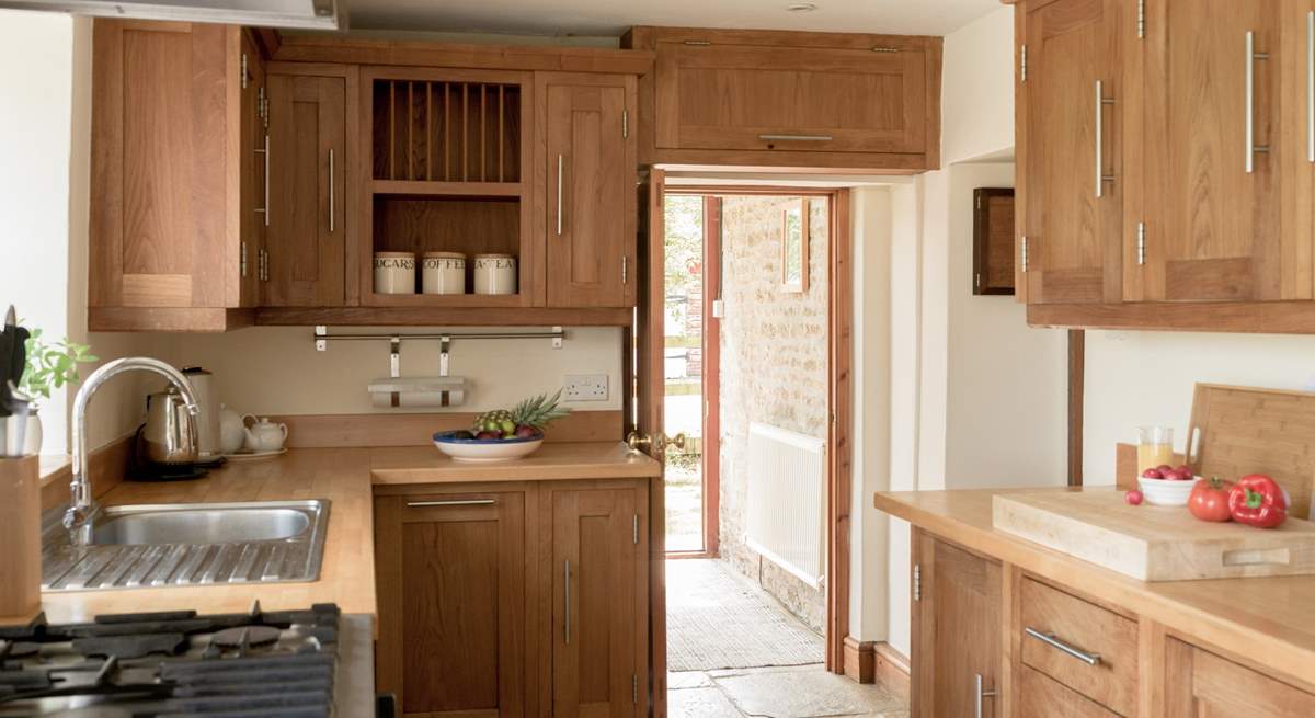 Entry into the kitchen via the handy boot-room off the parking area
