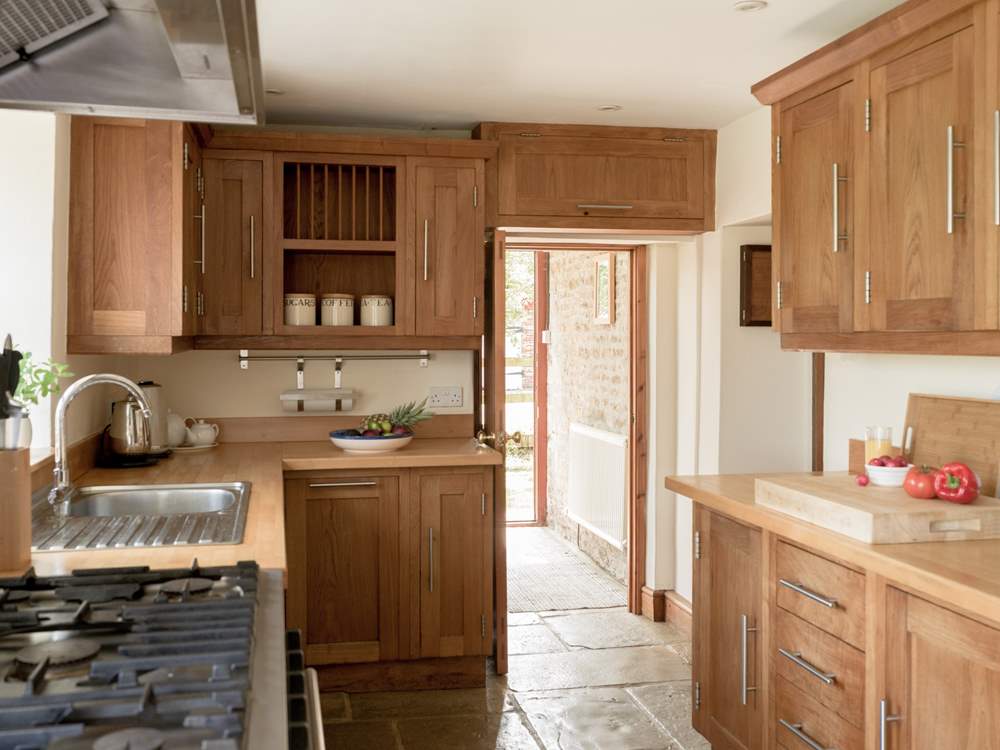 Entry into the kitchen via the handy boot-room off the parking area