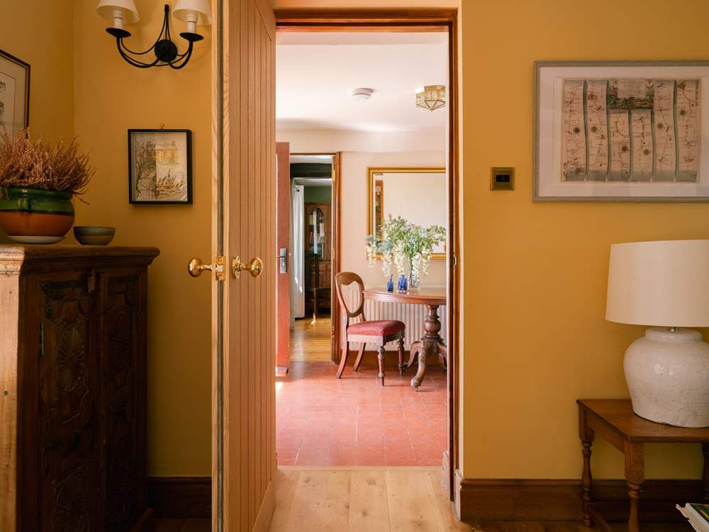 The living and dining both connected from the main hallway at the front of the house